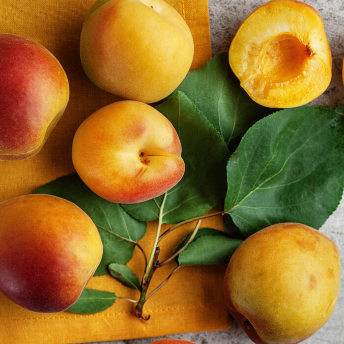 Fresh apricots with leaves