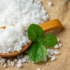 salt in wooden spoon place on floor